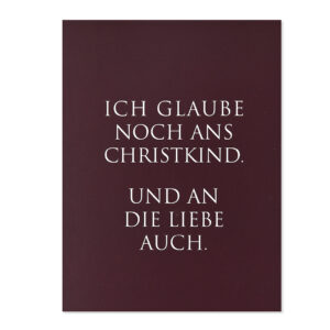 Weihnachtskarte mit bordeausfarbenem Hintergrund und weissem Text "Ich glaube noch ans Christkind"