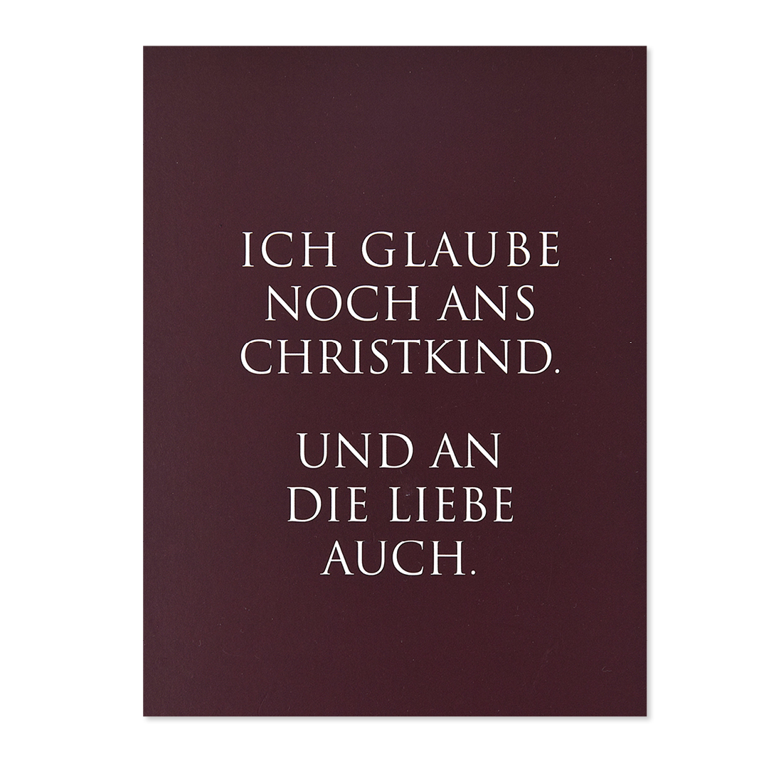 weihnachtskarte-wunderwort-ich-glaube-noch Weihnachtskarte mit bordeausfarbenem Hintergrund und weissem Text "Ich glaube noch ans Christkind"